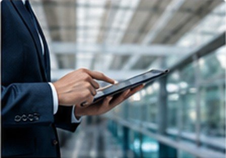 Business professional using a digital tablet